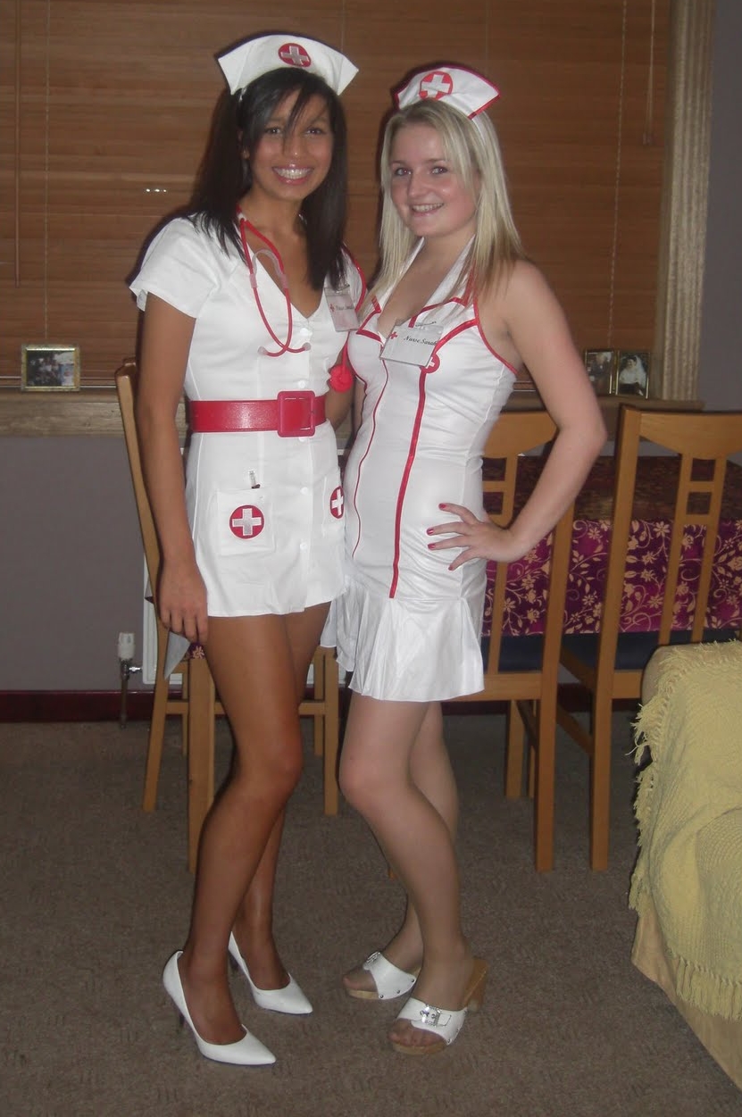 Two Nurses with Bare Legs wearing wearing White Short Dresses